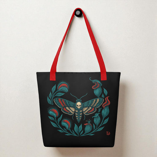Bolso tote negro con ilustración de polilla calavera, vista frontal con asas rojas.