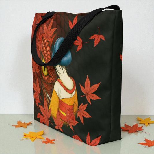 Bolso tote La mirada del Dragón en vista tres cuartos desde la izquierda con asas negras, superficie blanca con hojas de arce.