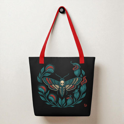 Bolso tote negro con ilustración de polilla calavera, vista frontal con asas rojas.
