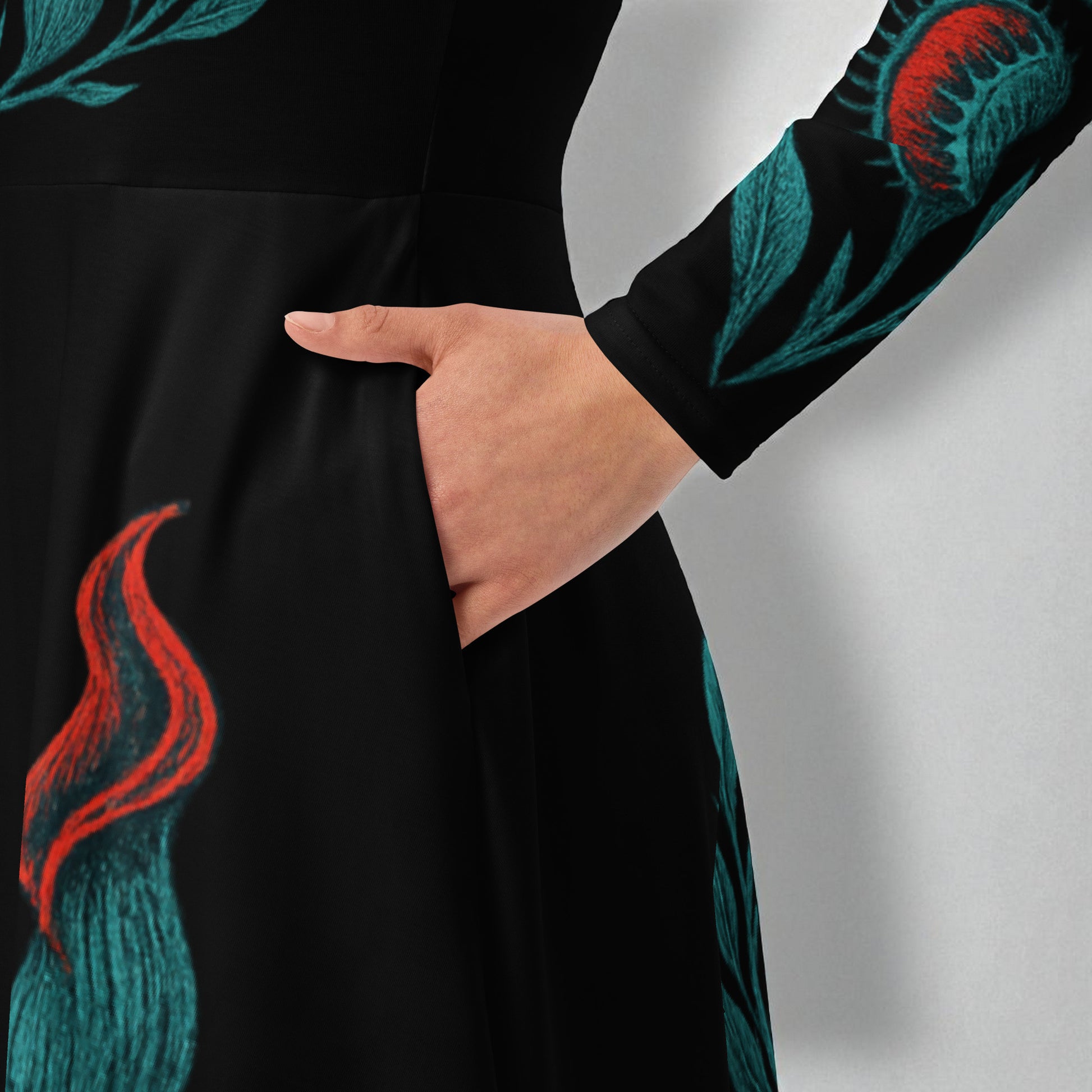 Detalle de bolsillo vestido manga y bolsillo midi negro con estampado botánico