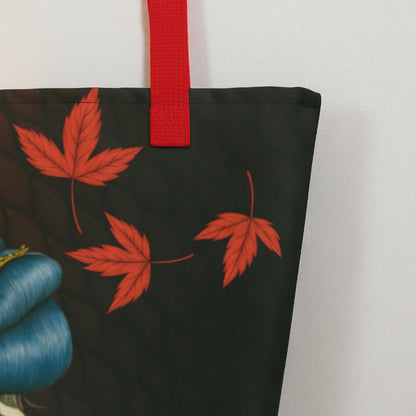 Detalle del bolso La mirada del Dragón mostrando la unión del asa roja y la costura lateral sobre fondo claro.