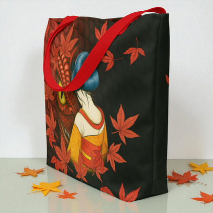 Bolso tote La mirada del Dragón en vista tres cuartos desde la derecha con asas rojas, superficie blanca con hojas.