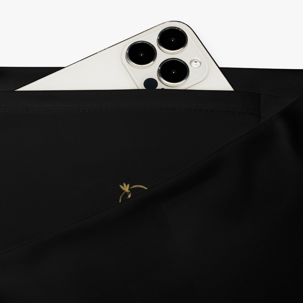 Leggings Crisantemo detalle del bolsillo oculto y textura del tejido.