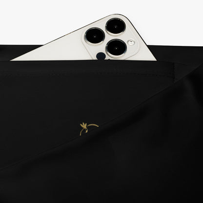 Leggings Crisantemo detalle del bolsillo oculto y textura del tejido.