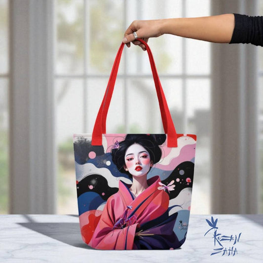 Bolso tote Geisha Rosa con asas rojas, sostenido con la mano frente a ventana luminosa, diseño artístico exclusivo Kuzen Saha.
