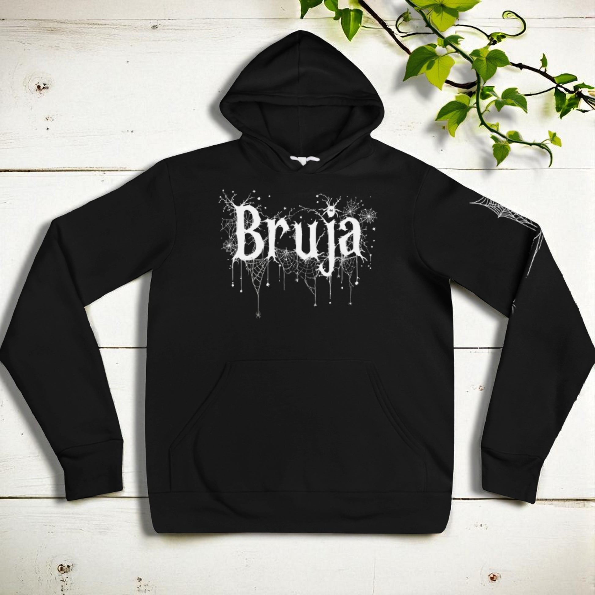 Sudadera Bruja vista plana frontal sobre tablones blancos