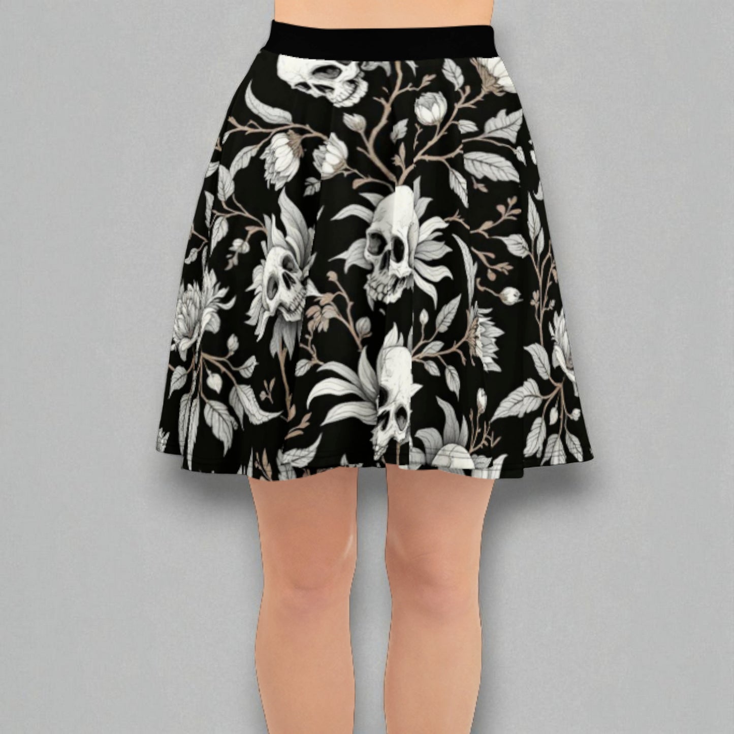 Detalle de cintura y tejido de la falda skater negra con estampado de calaveras