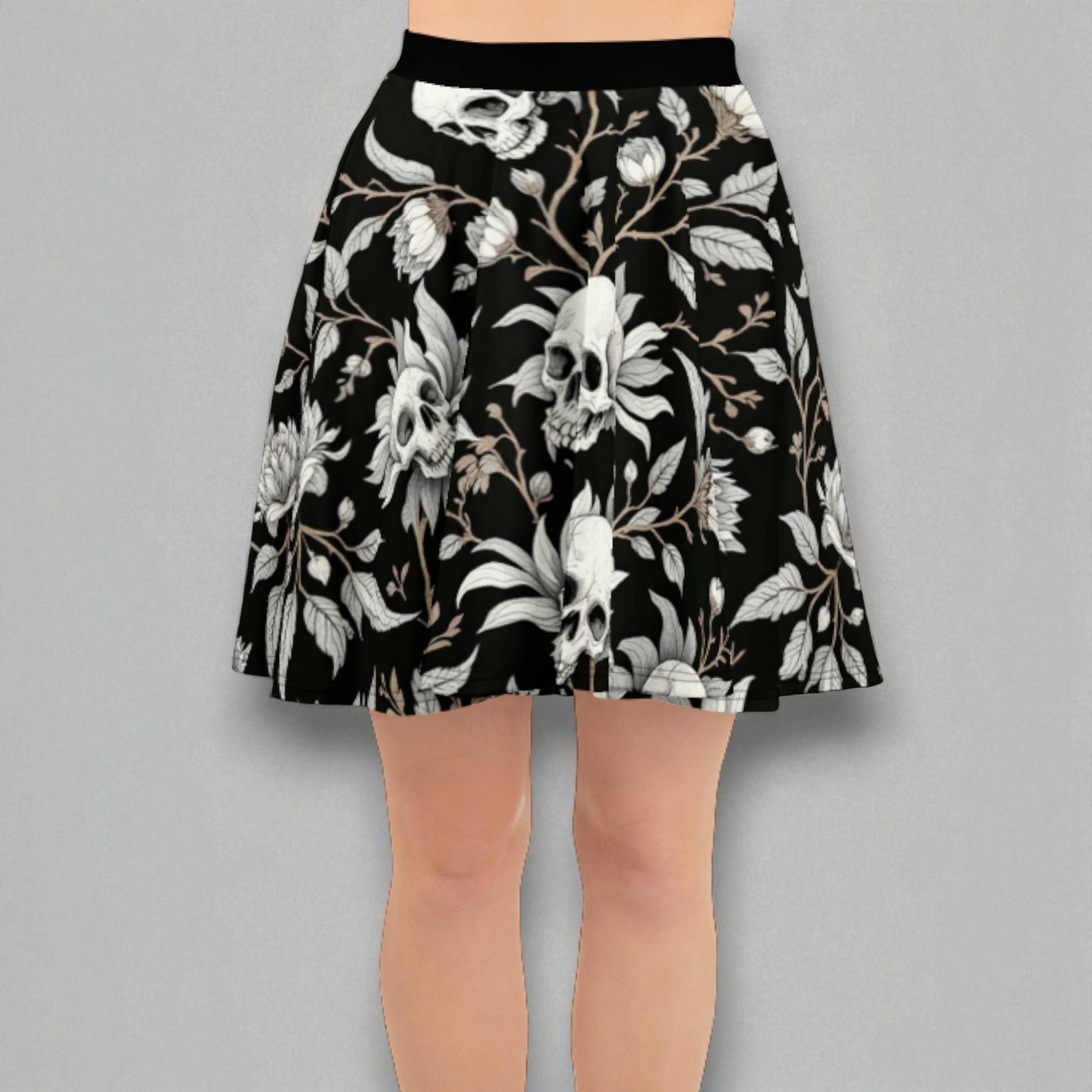 Detalle de cintura y tejido de la falda skater negra con estampado de calaveras