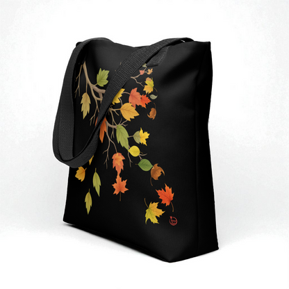 Bolso tote negro con estampado de hojas otoñales y asas negras, vista 3/4