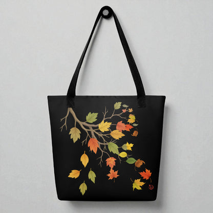 Bolsa tote negra con motivo de hojas de otoño y asas negras, vista frontal