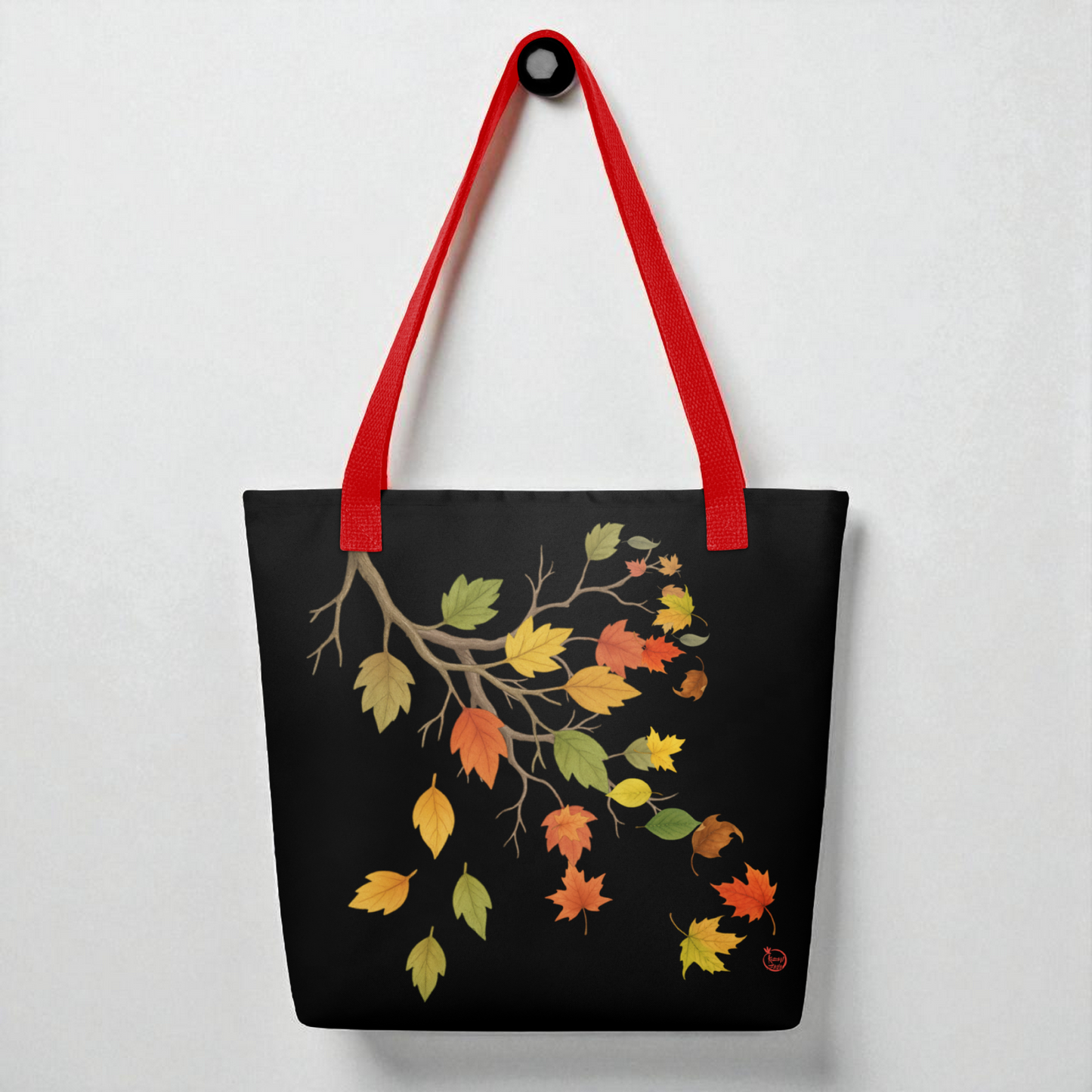 Bolso tote negro con hojas de otoño y asas rojas, vista frontal, estilo minimal